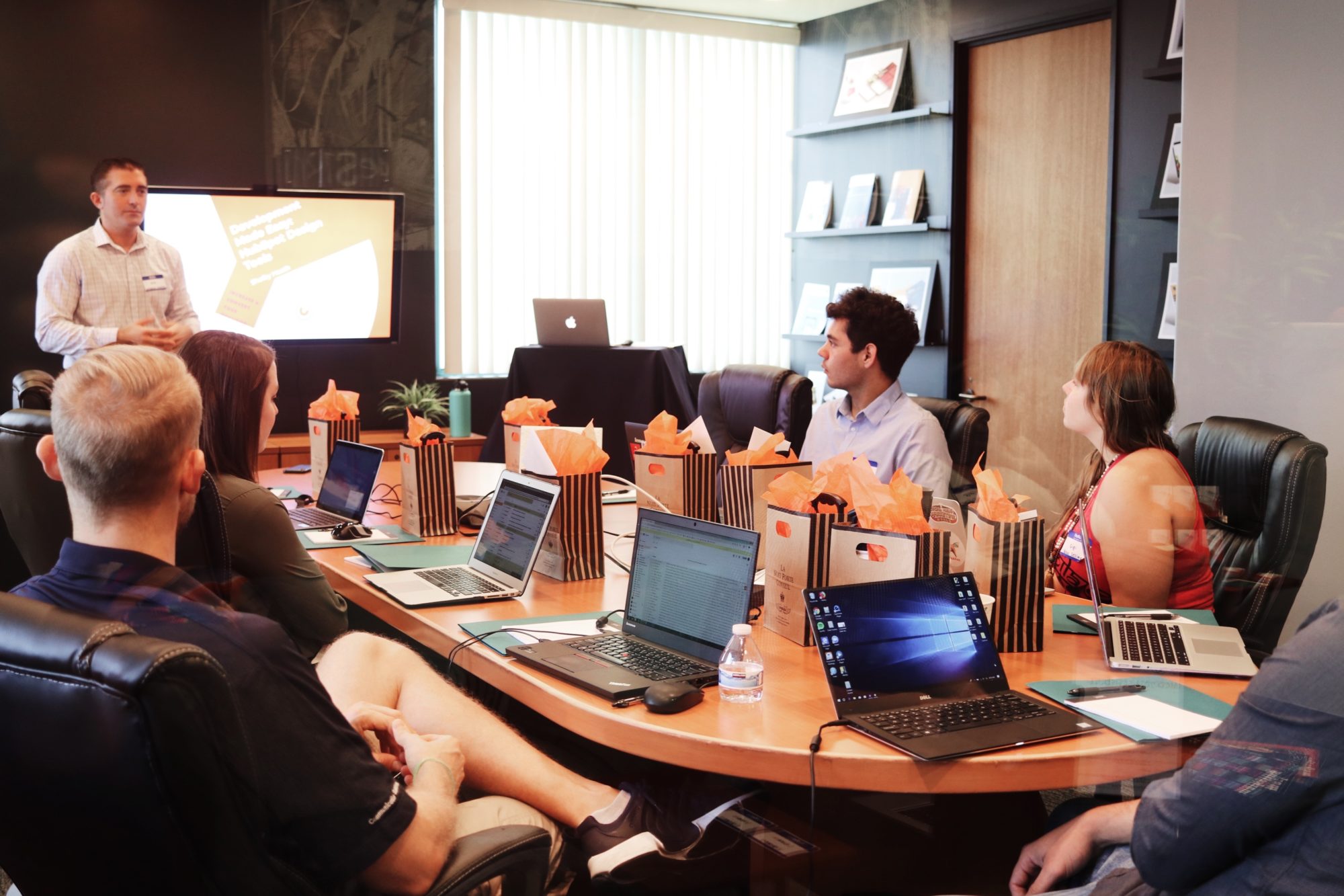 A man giving a presentation to a conference room