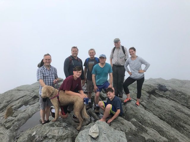 Group hiking photo at the summit of Camel's Hump