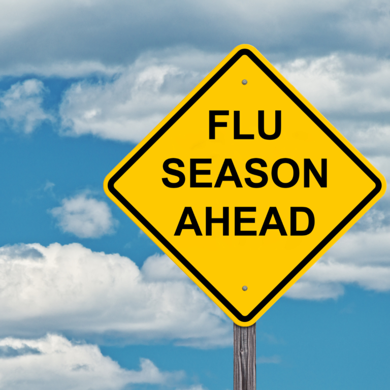Yellow traffic sign that says flu season ahead